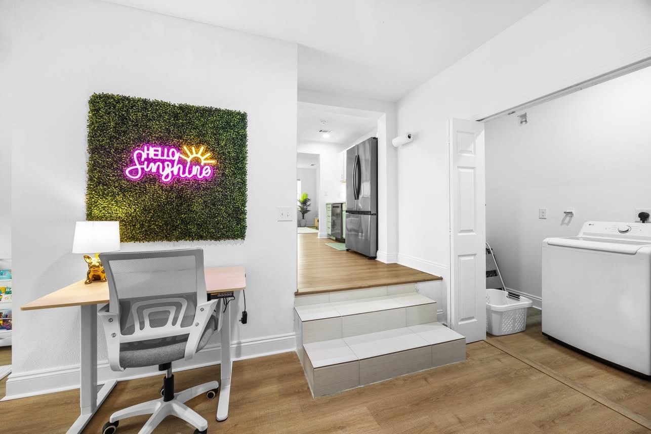 Hello Sunshine neon sign over a desk nook