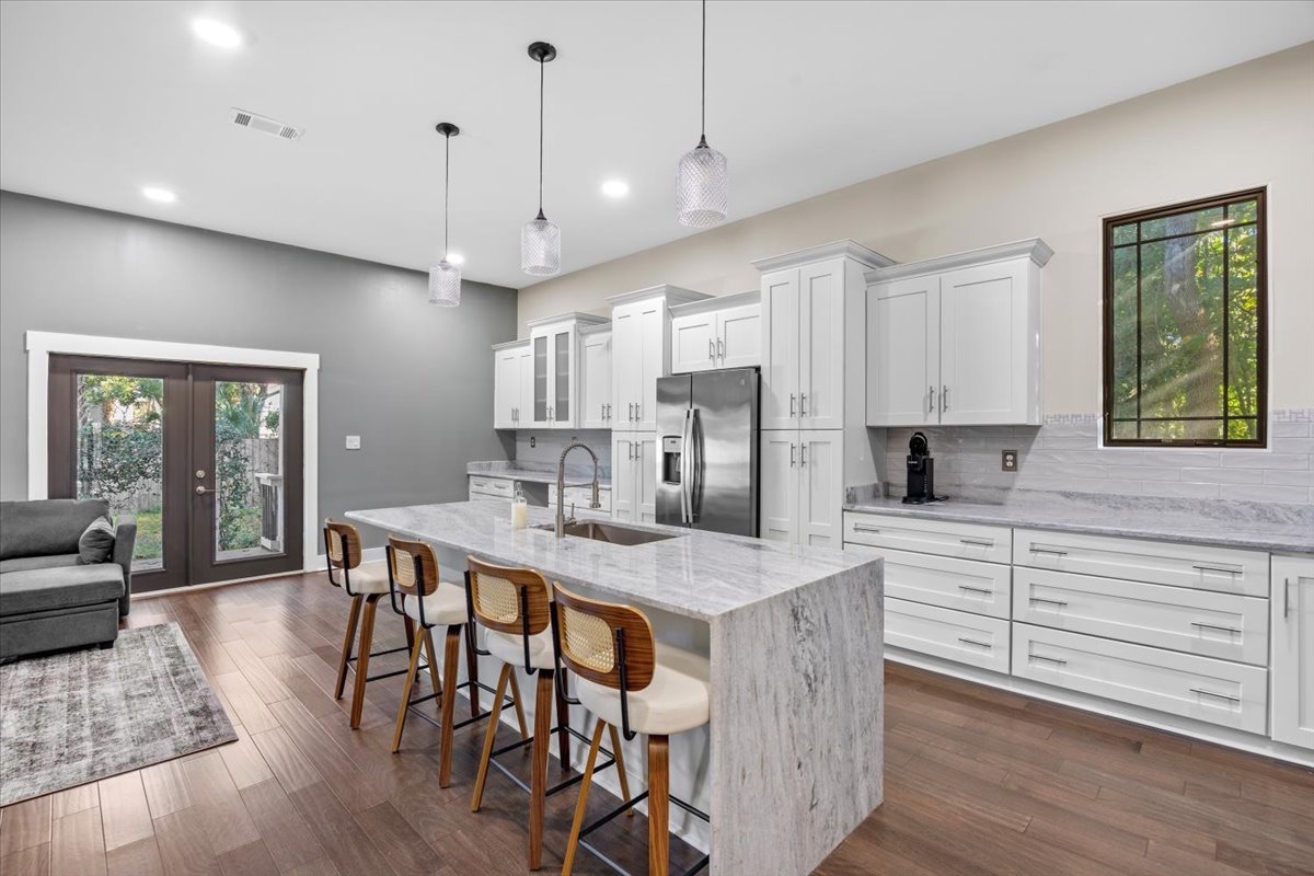 White kitchen with marble island